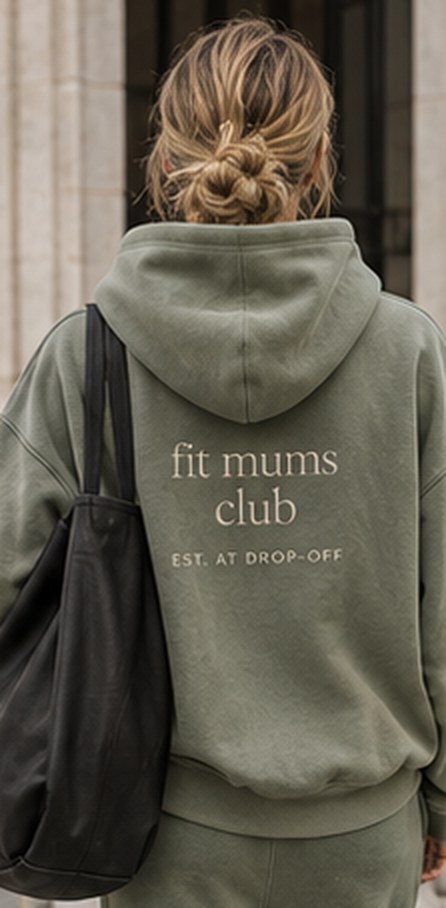 The back of a sage Fit Mums Club hoodie, embroidered 'fit mums club, est. at drop-off'